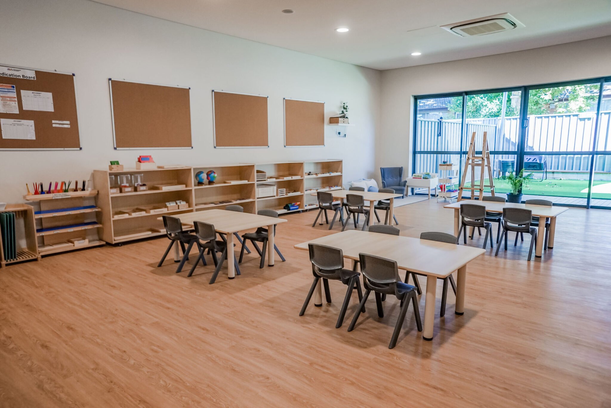 Childcare Preschool Classroom with Montessori Materials on Shelves