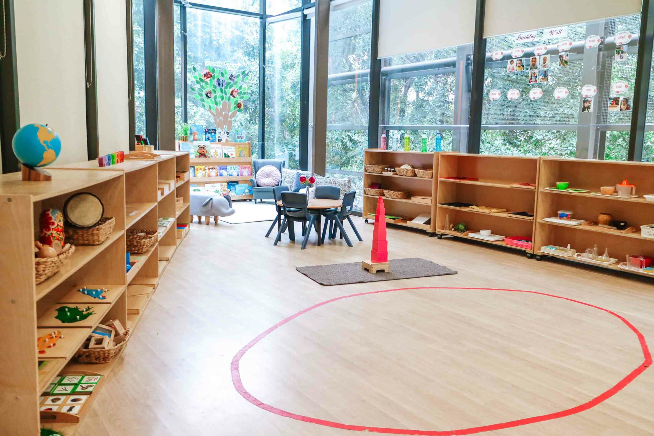 Classroom interior at Barangaroo Montessori Academy with shelves of educational materials and children’s books.