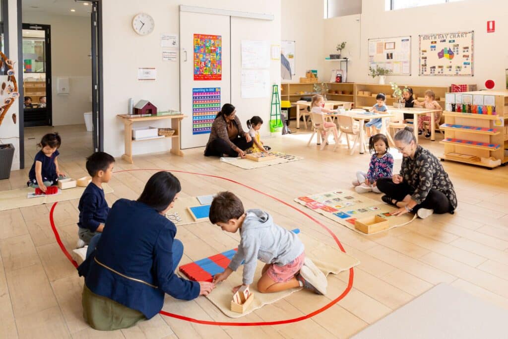 Montessori preschool classroom prepared learning environment engaging in Montessori work cycle